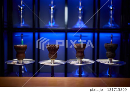 Person holding a hookah at a drinking establishment event Person holding a hookah at a drinking establishment event 121715899
