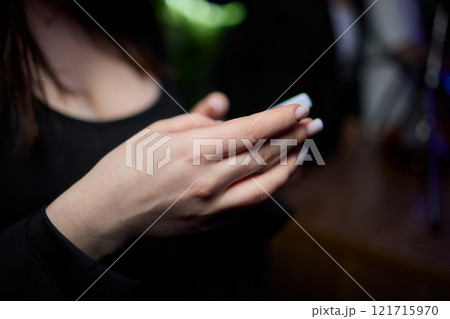 Woman in stylish dress with chic manicure using smartphone in closeup shot 121715970