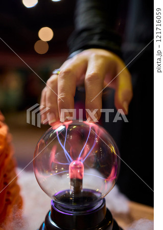 Captivating and mesmerizing interaction with a Plasma Globe awaits your exploration and fascination 121716059