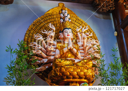 Shiva figurine on an altar inside a Buddhist temple 121717027