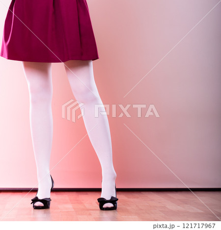 Fashion woman legs in white pantyhose 121717967