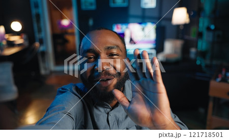 Point of view shot of content creator using smartphone to do live broadcast for subscribers, showing his home studio. Online star films himself for viewership using cellphone camera, POV perspective Point of view shot of content creator using smartphone to do live broadcast for subscribers, showing his home studio. Online star films himself for viewership using cellphone camera, POV perspective 121718501