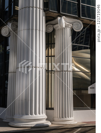 The morning light shining through Classic pillars detail of Modern building. The morning light shining through Classic pillars detail of Modern building. 121719146