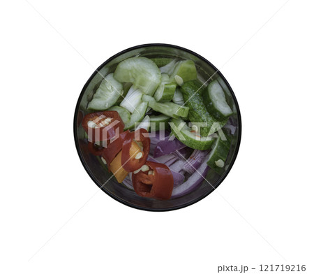 Ajat - Homemade thai cucumber slices, chili slices and shallots relish slices and vinegar in glass isolated on with background with clipping path. Ajat - Homemade thai cucumber slices, chili slices and shallots relish slices and vinegar in glass isolated on with background with clipping path. 121719216