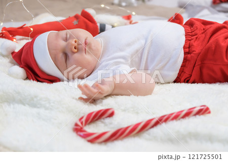Baby Boy in a Christmas Outfit on a Light Background. Selective Focus Baby Boy in a Christmas Outfit on a Light Background. Selective Focus 121725501