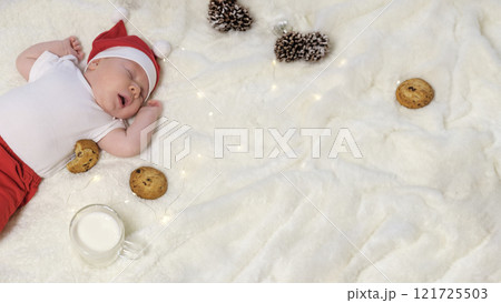 Two-Month-Old Baby in a Christmas Outfit with Milk and Cookies Two-Month-Old Baby in a Christmas Outfit with Milk and Cookies 121725503