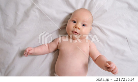 Joyful Two-Month-Old Baby Boy on a Light Background. Selective Focus 121725514