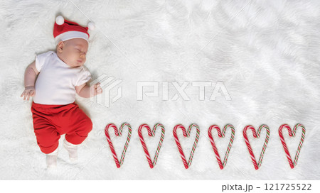 Baby Boy in a Christmas Outfit on a Light Background. Selective Focus Baby Boy in a Christmas Outfit on a Light Background. Selective Focus 121725522