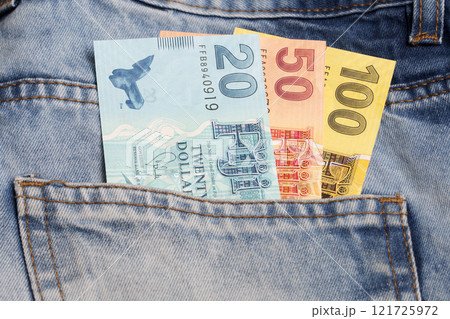 Fijian dollar in the pocket of blue jeans 121725972