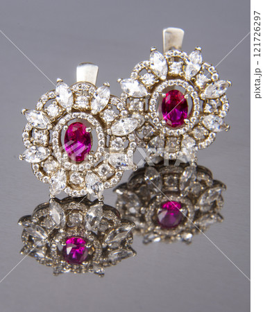 Diamond earrings with pink stone luxury jewerly macro close up Diamond earrings with pink stone luxury jewerly macro close up 121726297