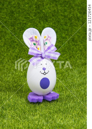 Easter toy bunny egg on green grass bright holiday Easter toy bunny egg on green grass bright holiday 121726454