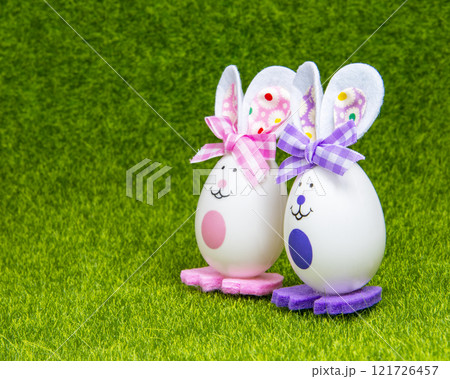 Easter handmade toy bunny egg no trademark on green grass bright holiday 121726457