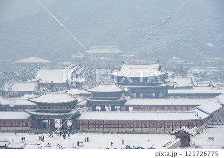 Winter snow at Gyeongbokgung Palace in Seoul, South Korea. Geunjeongjeon Pavilion of Gyeongbokgung South Korea's historical landmarks Winter snow at Gyeongbokgung Palace in Seoul, South Korea. Geunjeongjeon Pavilion of Gyeongbokgung South Korea's historical landmarks 121726775