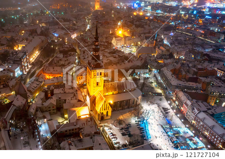 Aerial night View of Tallinn in winter, roofs are covered with snow, Christmas mood 121727104