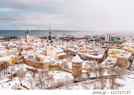 Aerial View of Tallinn in winter, roofs are covered with snow, Christmas mood 121727137
