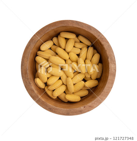 pills in wooden bowl isolated pills in wooden bowl isolated 121727348