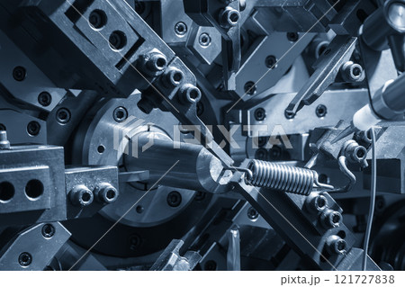 Close up scene operation of the coil spring making machine. Close up scene operation of the coil spring making machine. 121727838