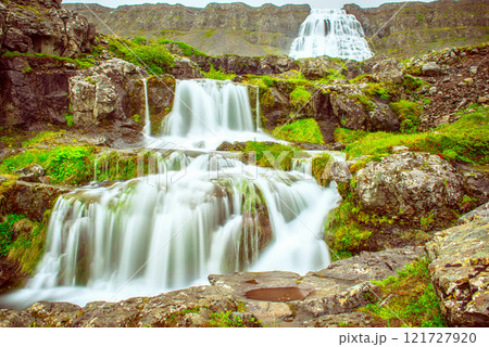Dynjandi is one the most famous waterfall of the West Fjords of Iceland at summer Dynjandi is one the most famous waterfall of the West Fjords of Iceland at summer 121727920
