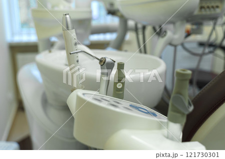 Advanced dental equipment arranged in a modern clinic for patient care 121730301