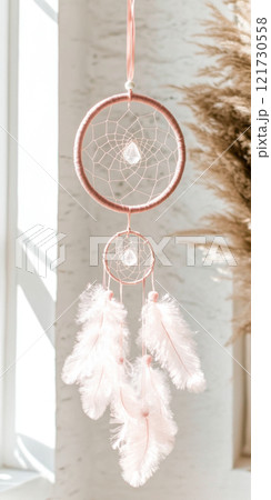 Dreamcatcher hanging in light airy room, boho decor background with copy space 121730558