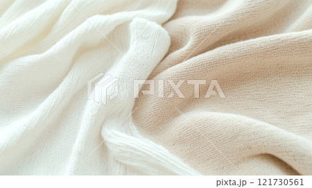 Soft beige and white knitted fabric texture background 121730561