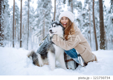 A young woman with her pet on an adventure. Friendship concept, pets. 121730734