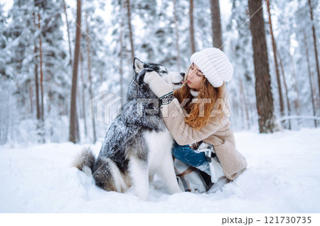 A young woman with her pet on an adventure. Friendship concept, pets. 121730735