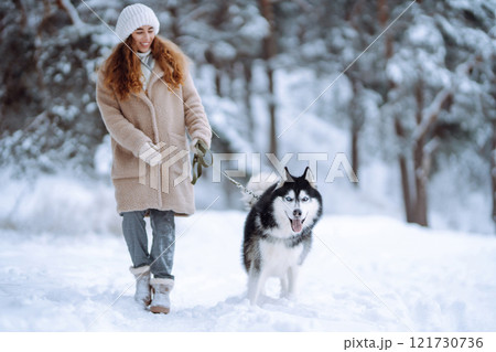 A young woman with her pet on an adventure. Friendship concept, pets. 121730736