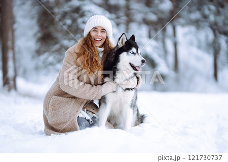 A young woman with her pet on an adventure. Friendship concept, pets. 121730737