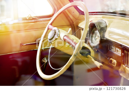 Steering wheel and interior of retro car 121730826