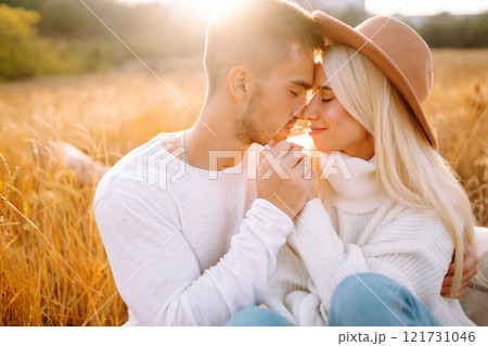 Young couple having fun walking and hugging n the park. Autumn weather. Relaxation, youth. 121731046