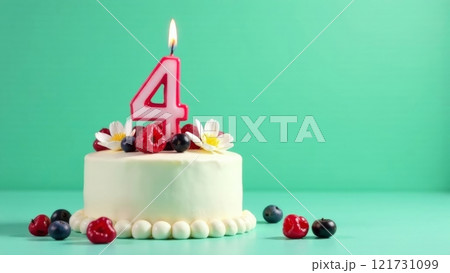 A vibrant birthday cake adorned with fresh berries and flowers features a large candle that reads four. The cake is set against a bright green backdrop, enhancing the festive atmosphere. Copy space A vibrant birthday cake adorned with fresh berries and flowers features a large candle that reads four. The cake is set against a bright green backdrop, enhancing the festive atmosphere. Copy space 121731099