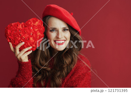 smiling trendy woman in red sweater and beret 121731395