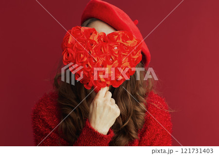Closeup on woman in red sweater and beret Closeup on woman in red sweater and beret 121731403