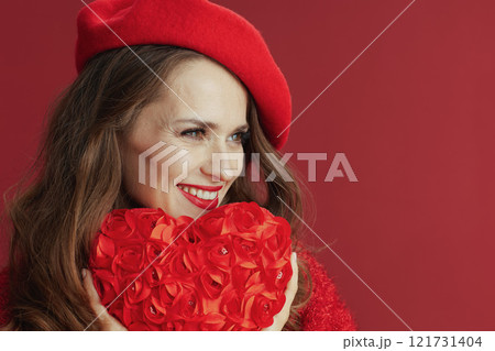 happy trendy 40 years old woman in red sweater and beret 121731404