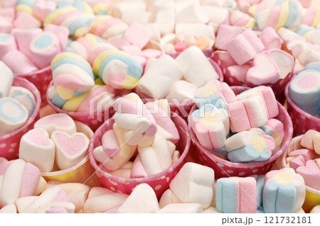 Confectionery and sweeties varieties background: light pink and white marshmallows, sugar confetti, bonbon and candies, selective focus, shallow focus Confectionery and sweeties varieties background: light pink and white marshmallows, sugar confetti, bonbon and candies, selective focus, shallow focus 121732181