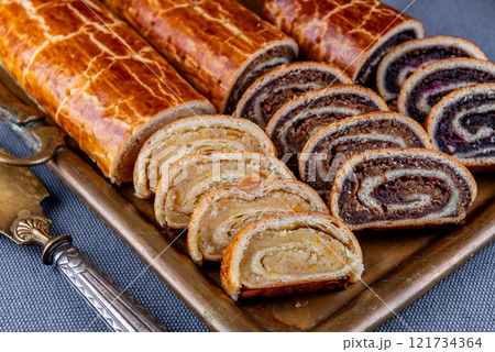 Traditional Hungarian Christmas cookies with poppy seed, walnut and almond on a copper serving tray Traditional Hungarian Christmas cookies with poppy seed, walnut and almond on a copper serving tray 121734364