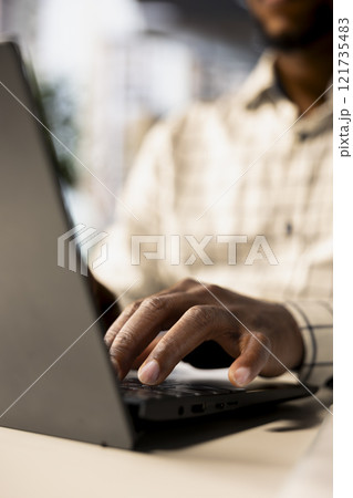 Confident businessman at his office desk working on report writing, financial planning and deadline management. Expert specialist reviewing objectives and goals to ensure success. Close up. 121735483