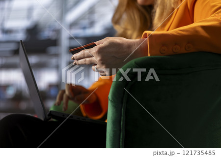 General manager using her card to purchase clothes and treat herself, solving bills payment and doing online shopping. Female boss entrepreneur being proud spending money, success story. 121735485