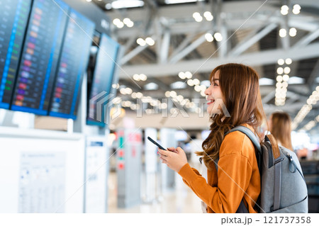 Young asian woman in international airport Young asian woman in international airport 121737358