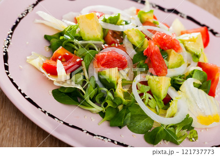 Tasty salad of avocado, grapefruit, tomatoes and corn salad Tasty salad of avocado, grapefruit, tomatoes and corn salad 121737773
