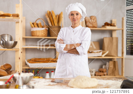 Woman mixes liquid ingredients in bowl with whisk Woman mixes liquid ingredients in bowl with whisk 121737891
