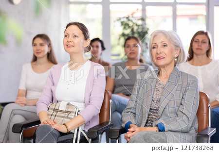 In audience, students sit staring at teacher and listen to lecture In audience, students sit staring at teacher and listen to lecture 121738268