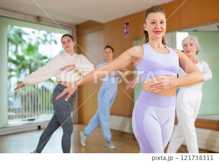 Group are practising arch movement in step jazz dance in fitness gym Group are practising arch movement in step jazz dance in fitness gym 121738311