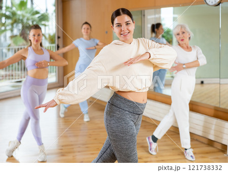 Dynamic young woman dancing hip-hop 121738332