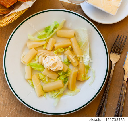 Vegetarian dish boiled asparagus served with mayonnaise 121738583