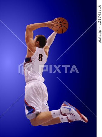 Basketball player wearing a white and blue uniform is jumping to score during a match Basketball player wearing a white and blue uniform is jumping to score during a match 121743216