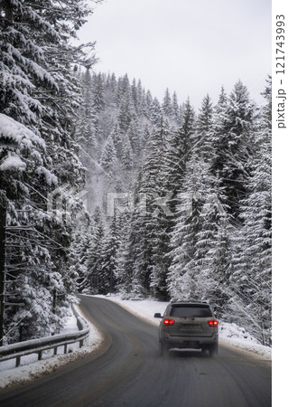 Car on Snowy Mountain Road Car on Snowy Mountain Road 121743993