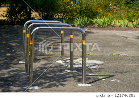 Bicycle parking racks on the asphalt area in the school yard 121746805