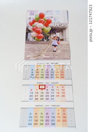 tear-off calendar with photos first of september on a white table.  121747823